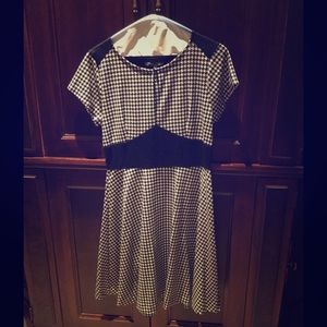 Retro houndstooth dress with yoke waist.