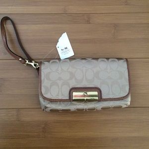 Coach wristlet/clutch in monogrammed canvas