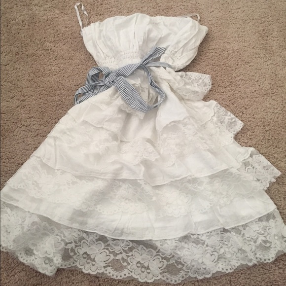 White lace dress with striped navy blue belt