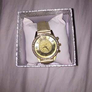 Gold colored watch