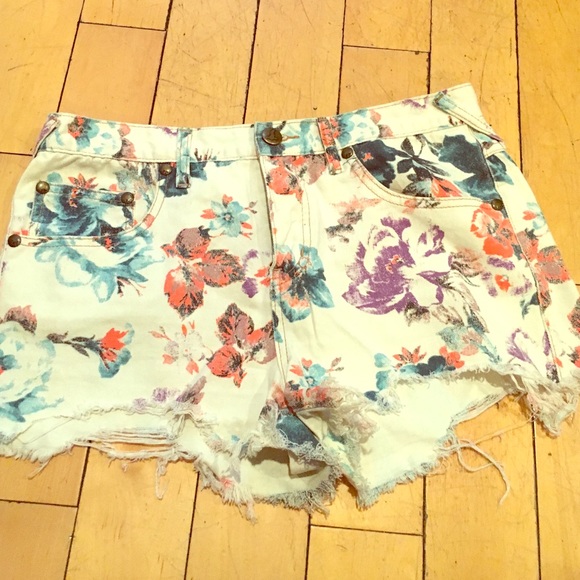 Free people denim floral shorts.