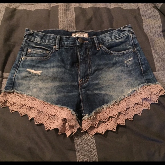 Free people jean shorts with lace trim