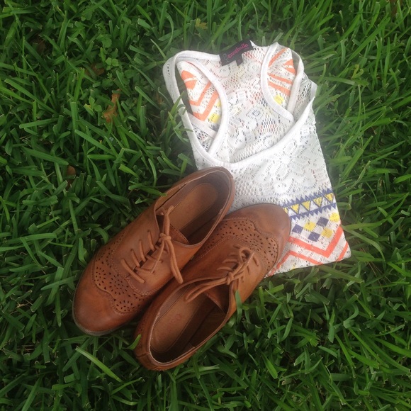 Brown Bongo shoes with cut out pattern design.