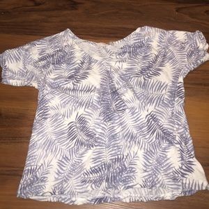 White shirt with blue leaf design