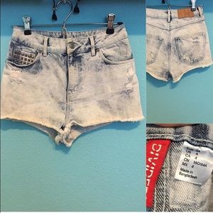 Washed, distressed denim shorts