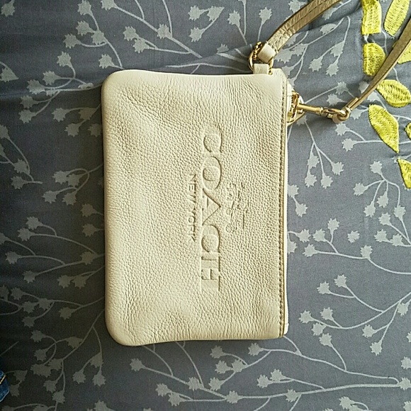 AUTHENTIC  creme colored wristlet