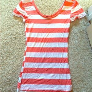an orange and white stripped shirt.