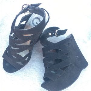 Guess black strappy wedge heels.