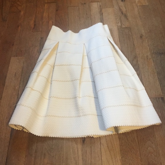 Cream high waisted skirt.