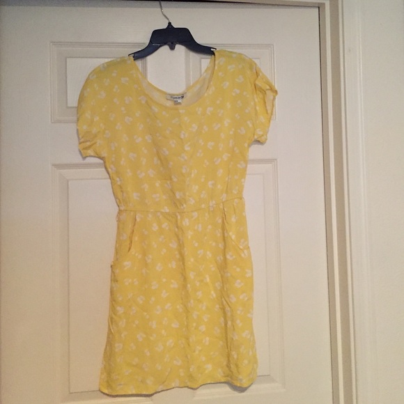 Bright yellow pocket dress with cherry pattern