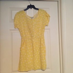 Bright yellow pocket dress with cherry pattern