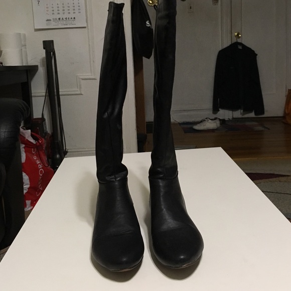 Black riding boots.