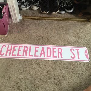 Cheerleader street wall sign