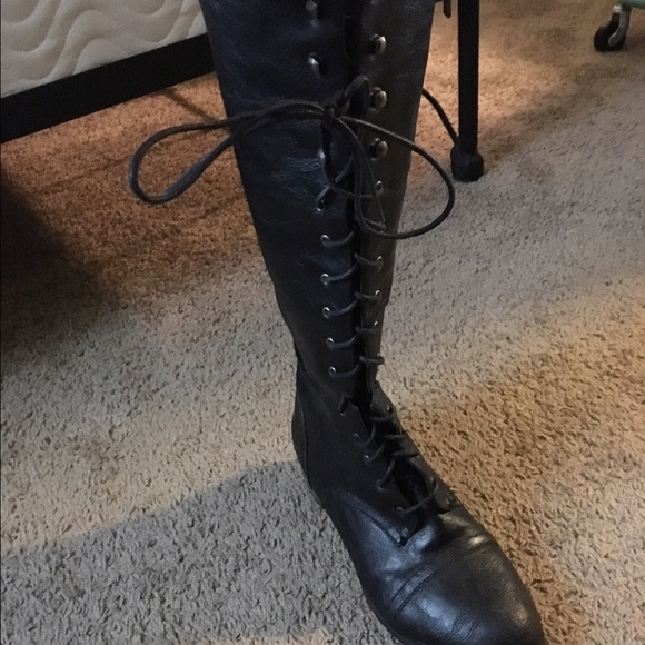 Tall black combat boots