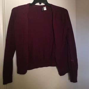 Maroon cardigan.
