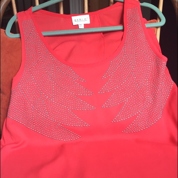 Red/orange studded sleeveless top with open back