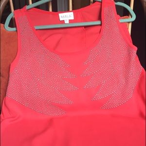 Red/orange studded sleeveless top with open back