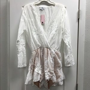 White romper with floral stitching