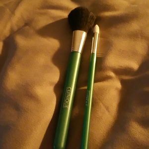 Green Clinique makeup brushes