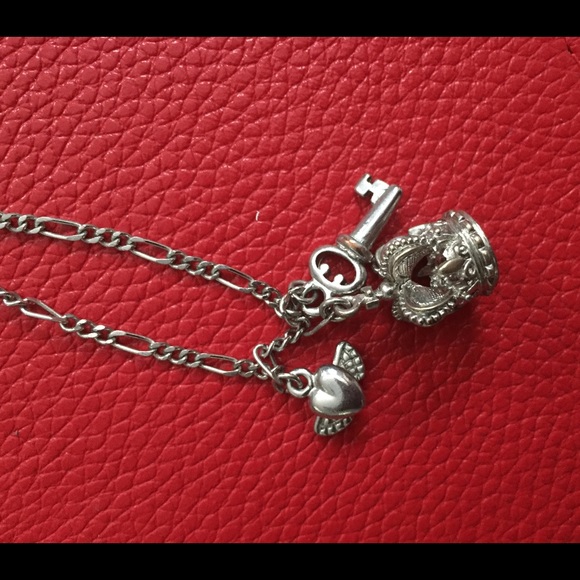 SOLD Guess charm necklace. Silver tone
