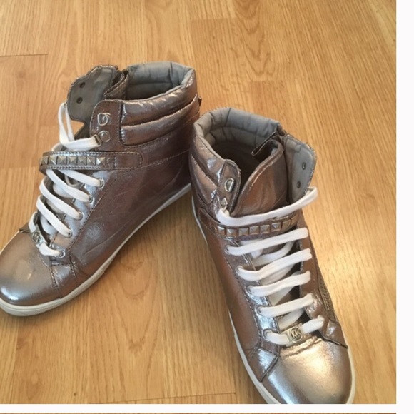 Micheal Kors metallic high top sneakers.