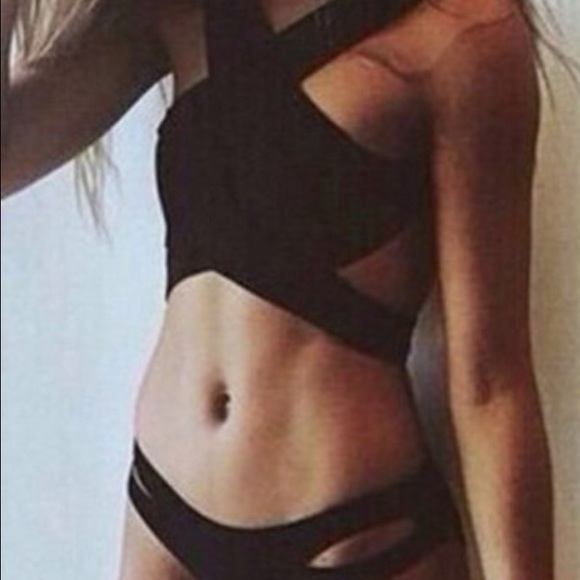 Black strappy bathing suit.