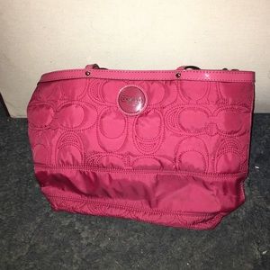 Pink Coach purse.