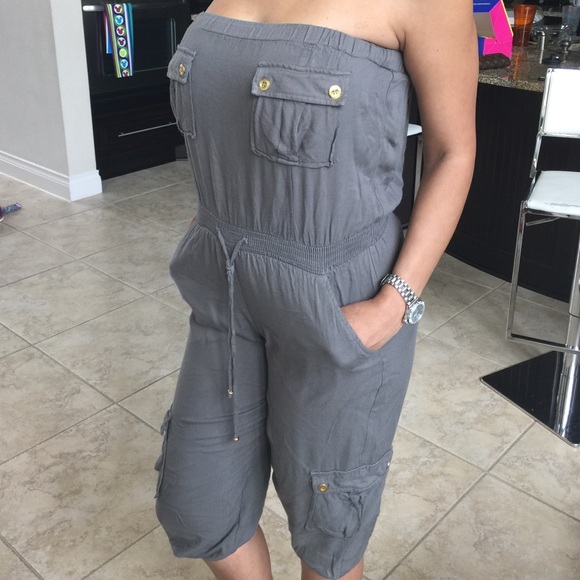 Army green jumpsuit with gold buttons by BEBE