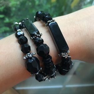 Three black bracelets