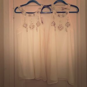 Two cream color dresses