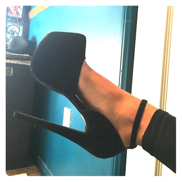 Tall black platforms with ankle strap