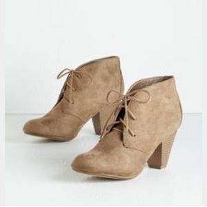 Taupe lace-up booties.