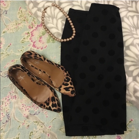 Black pencil skirt with polka dot detail.