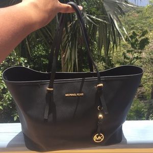 Michael Kors Jet set black XL travel hand bag.