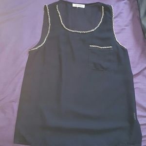 Black top with golden chain lining