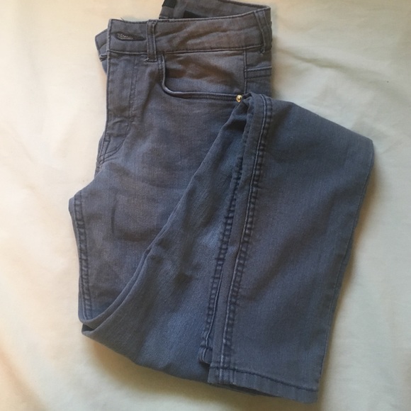 Gray Skinny Jeans with Gold hard wear.