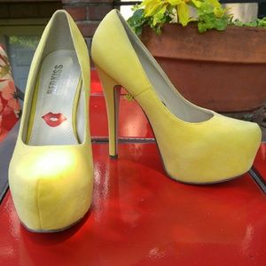 Yellow suede high heel pumps