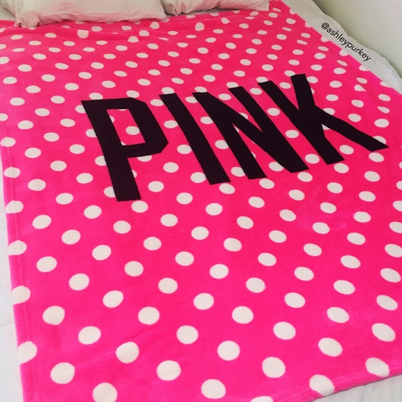 pink blanket with white polka dots