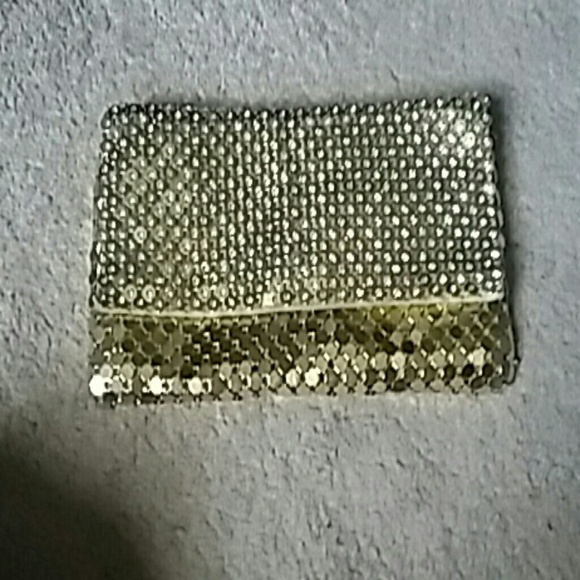Beautiful gold clutch with rhinestones on it