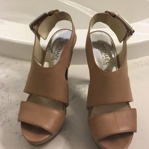 Michael Kors 3 1/2" platform nude heel.