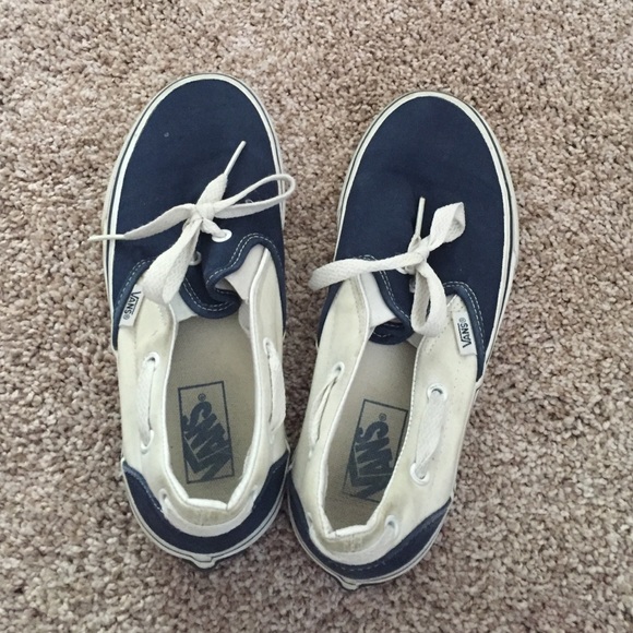 Navy blue and white slip on vans