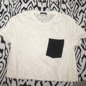White top with black pocket