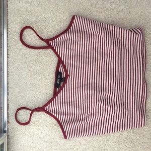 Red and white striped crop top .