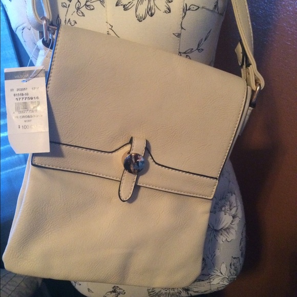 A cross body beige purse