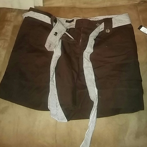 Brown cuff leg shorts. With stripe accent and belt