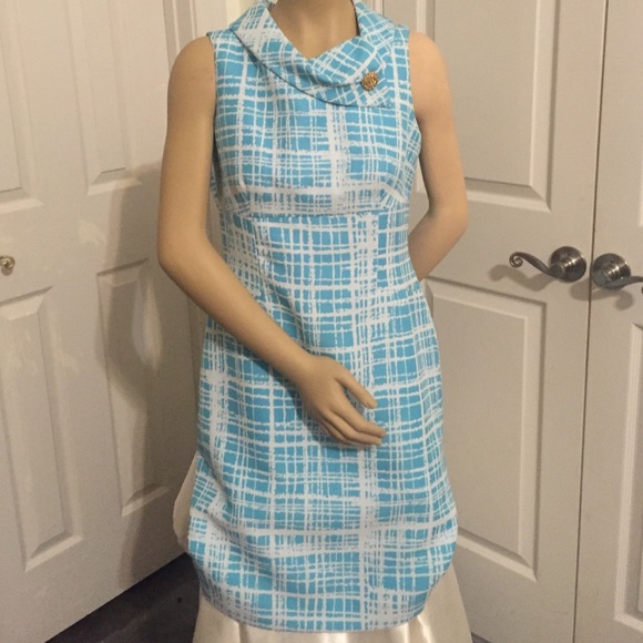A Tahari teal and white dress