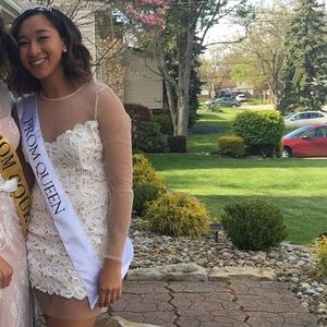 Short, long-sleeved white lace dress with lace top