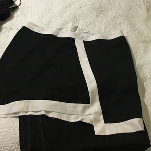 Black asymmetrical skirt with white trim