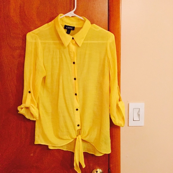 Bright yellow button down blouse.