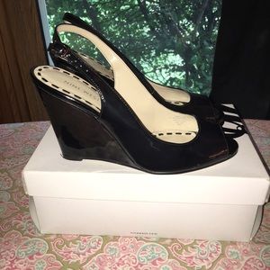 Nine West sling back peep toe wedges.